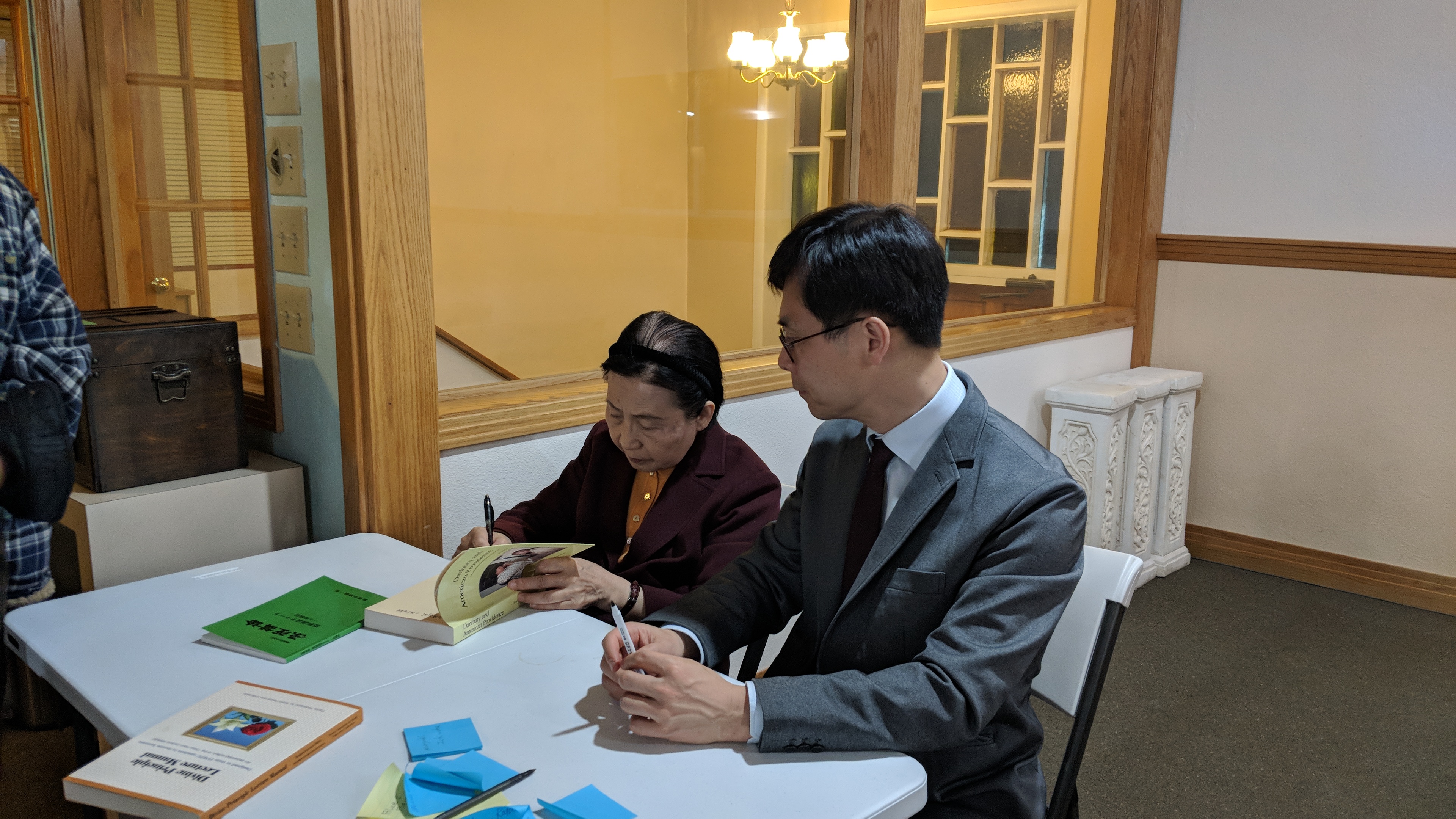 Mrs. Eu signing books with her son Jinseung